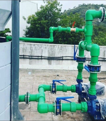 Worker handling pipes